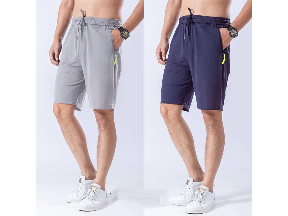 Two men wearing athletic shorts in grey and dark blue.