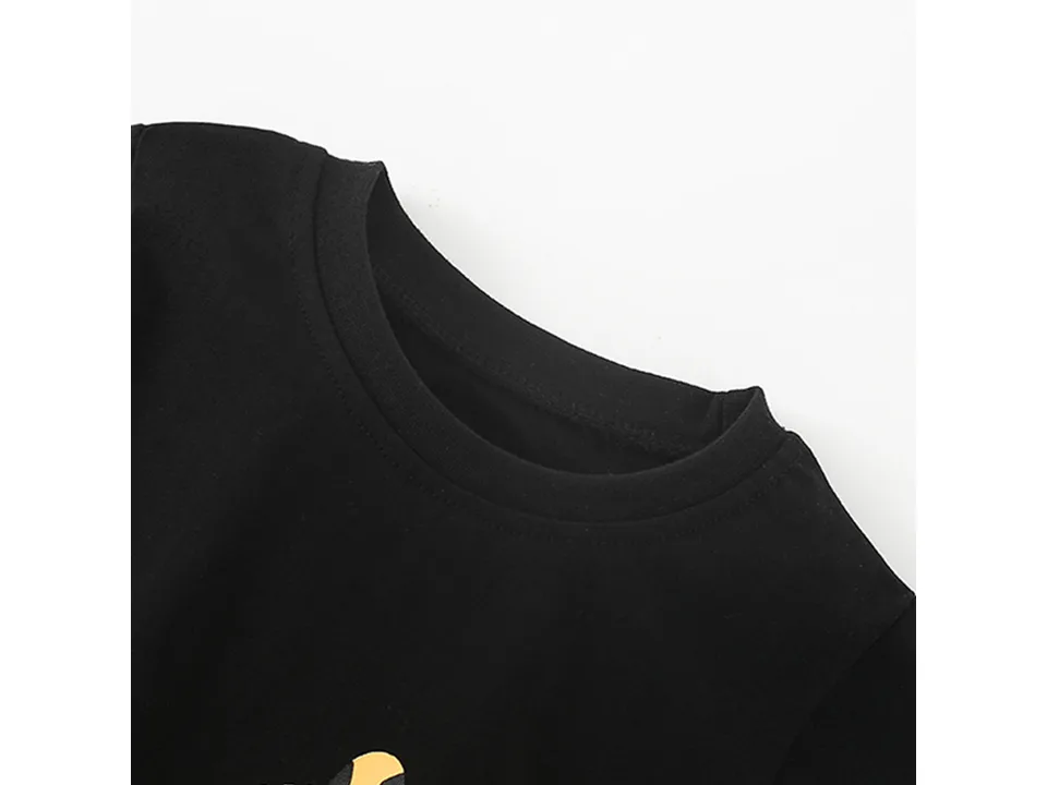Close-up of the round neckline of the black t-shirt.