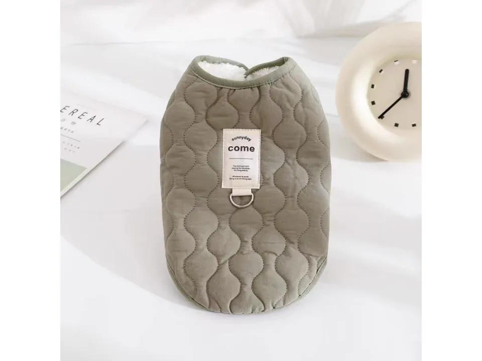 An olive green quilted pet vest with a D-ring and a 'sunnyday come' label.