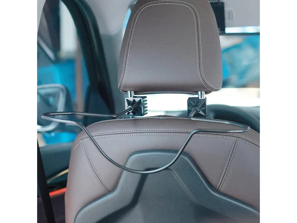 Car headrest hat hanger installed on a car seat headrest.