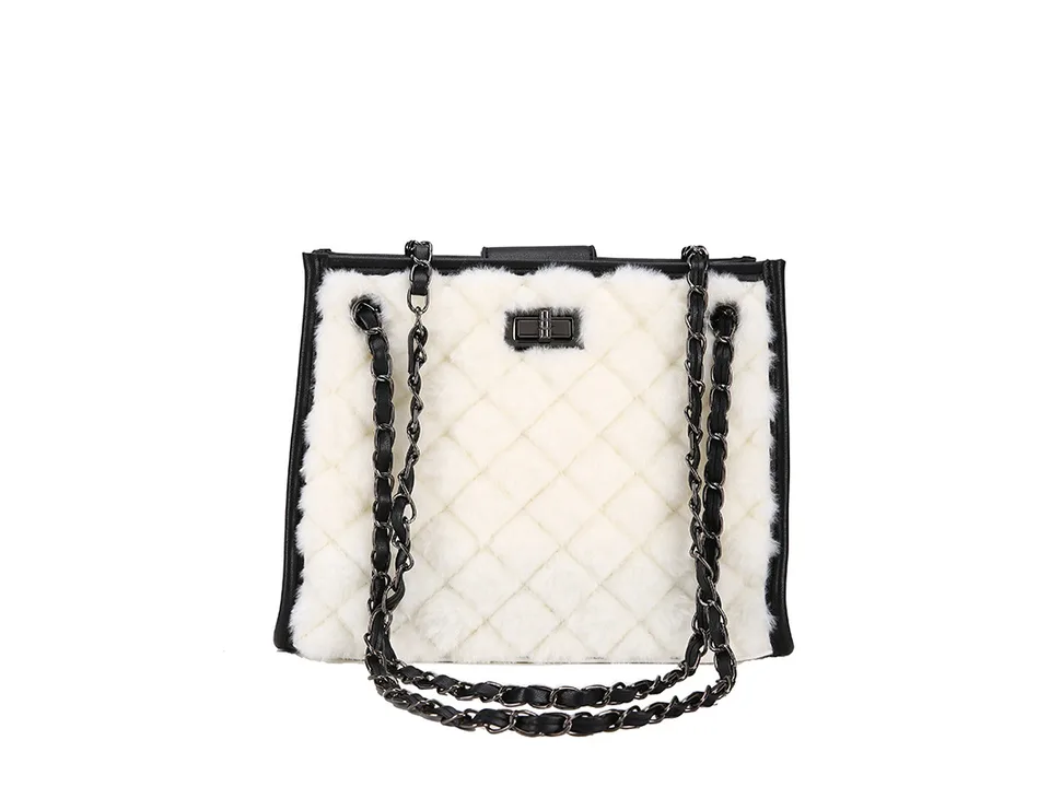 White plush quilted handbag with black chain strap on a white background