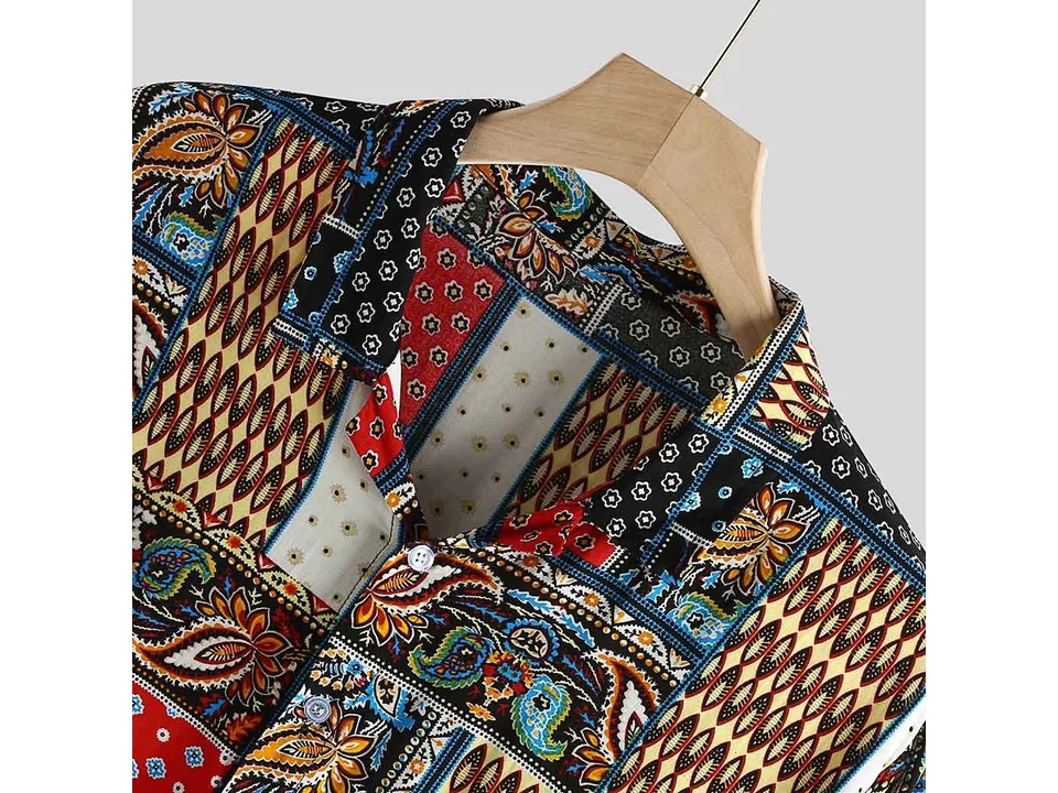 A close-up view of the shirt's collar and fabric, highlighting the detailed vintage patchwork pattern.