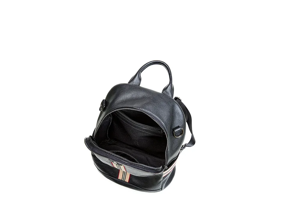 Open black leather backpack showing the interior lining and storage space.