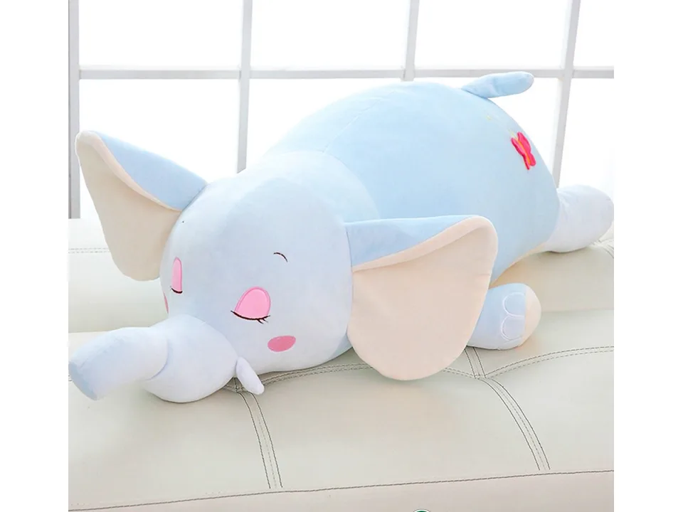 A blue elephant plush toy lying on a white surface.