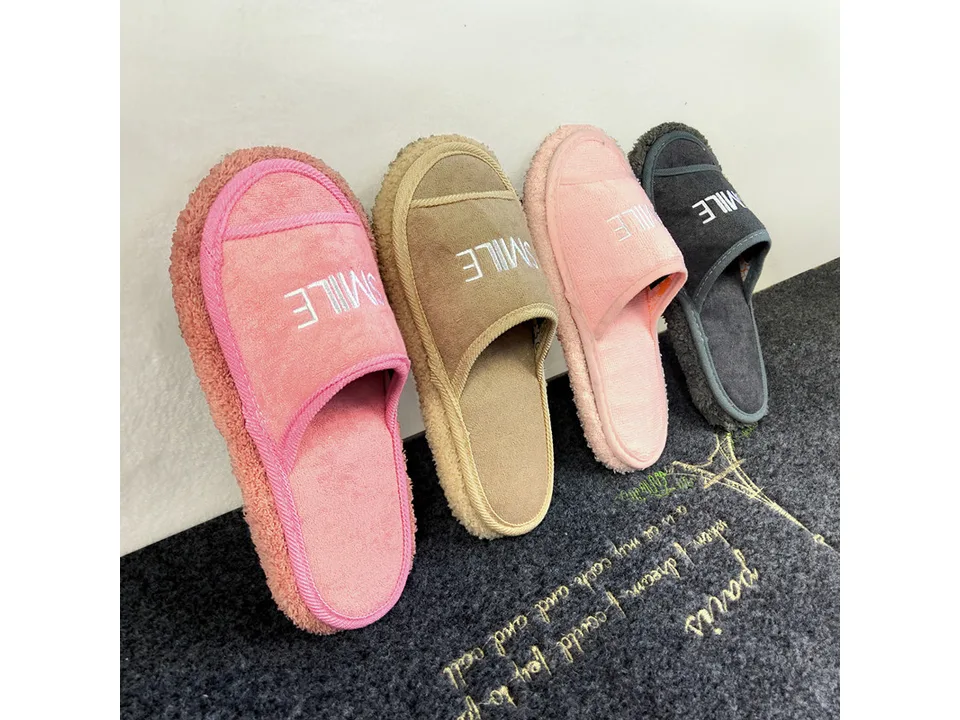 Four different colored slippers lined up, showing the range of options.