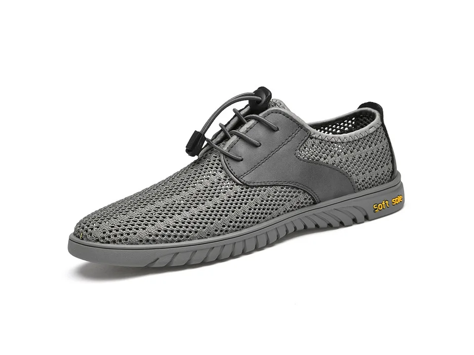 Side view of a grey breathable mesh sneaker with toggle lacing.