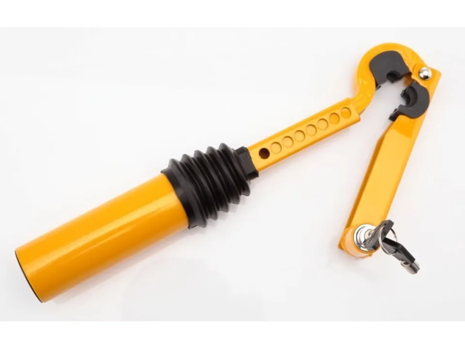 Yellow gear shift security lock with keys.