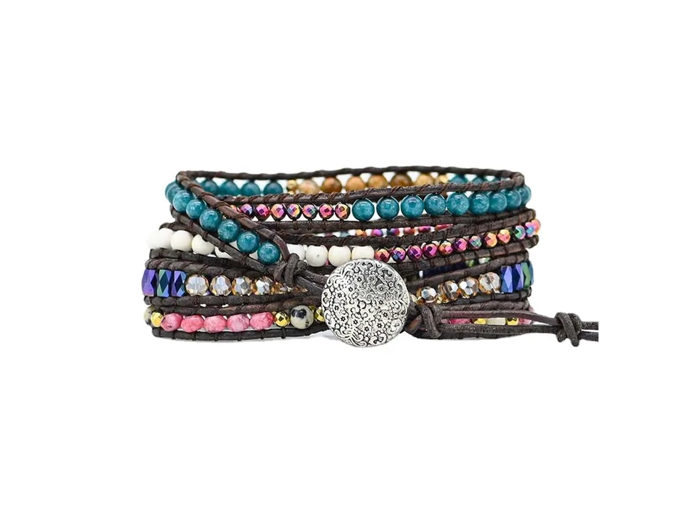 A multi-stone wrap bracelet with a large pink central stone on a white background.