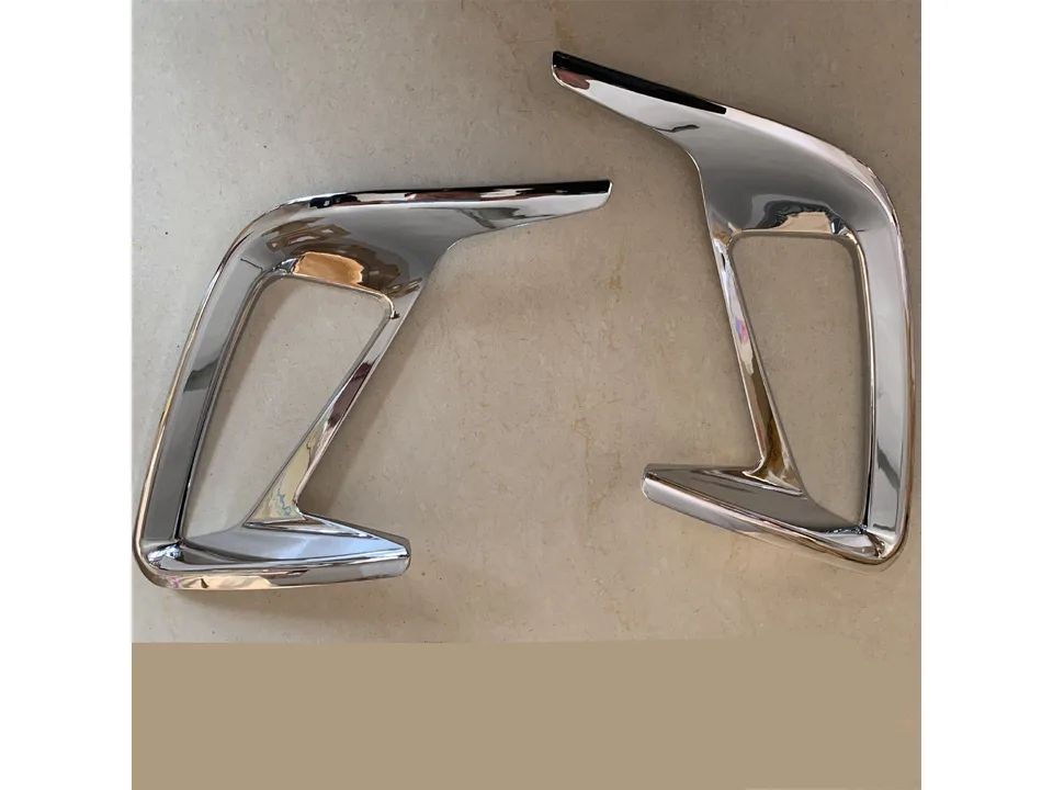 Pair of chrome finish rear fog lamp frame trims.
