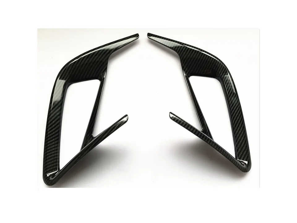 Angled view of the carbon fiber style rear fog lamp frame trims.