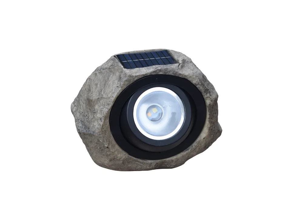 A rock-shaped solar garden spotlight with the solar panel on top.