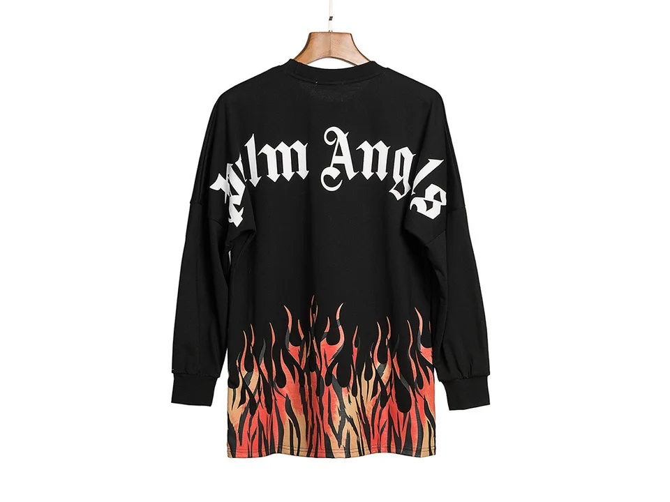 Back view of the black long-sleeve sweatshirt with a flame print at the bottom, hanging on a hanger.