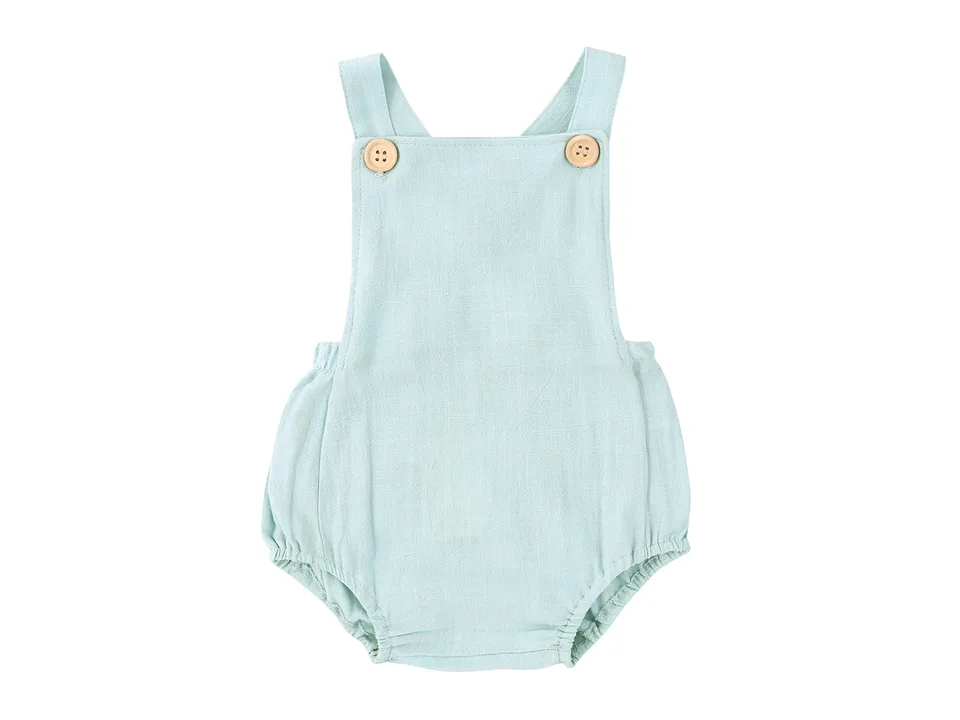 Light green baby romper with wooden buttons
