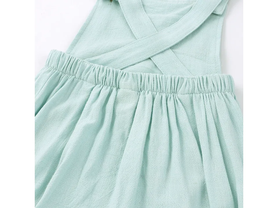 Back view of light green baby romper showing straps and elastic waist