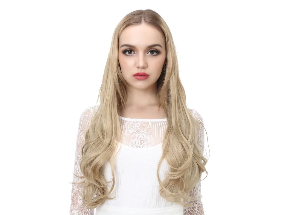Model wearing long curly blonde hair extensions.