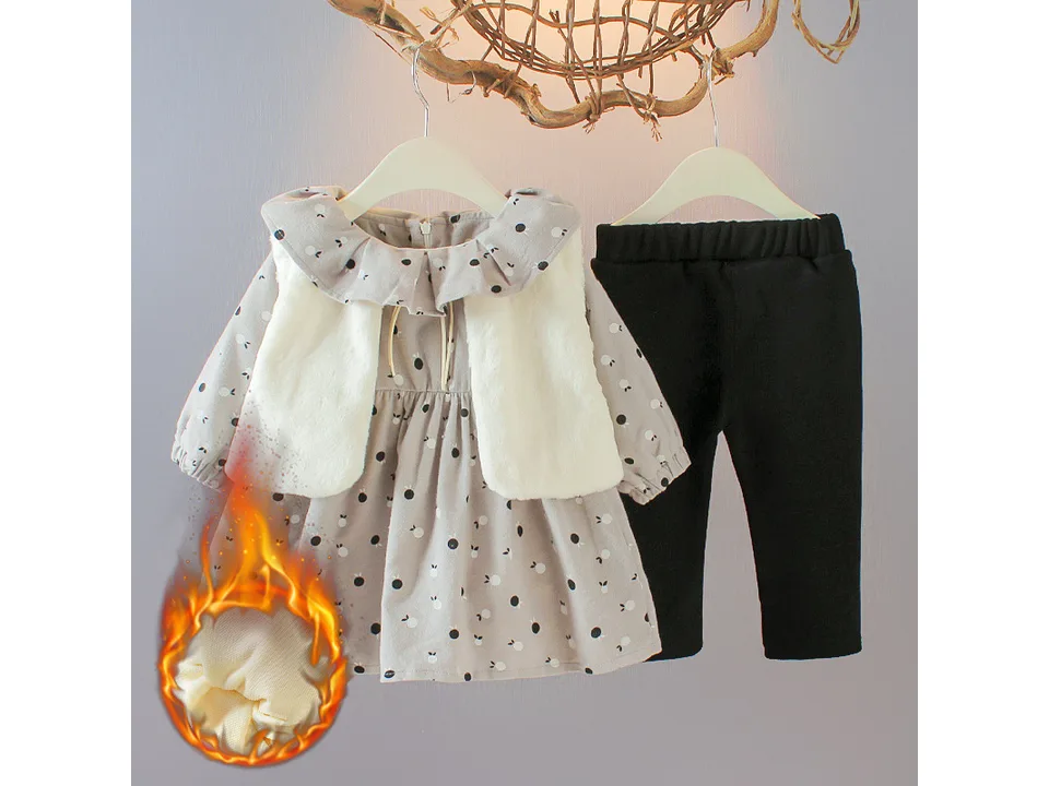 Grey baby girl outfit set with plush vest, long sleeve dress, and black pants, showing warm lining detail.
