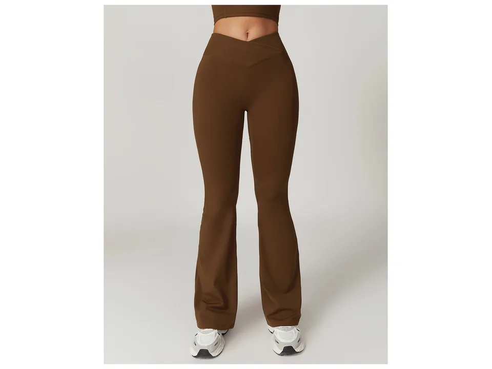 Front view of brown high-waisted flare yoga pants on a model.