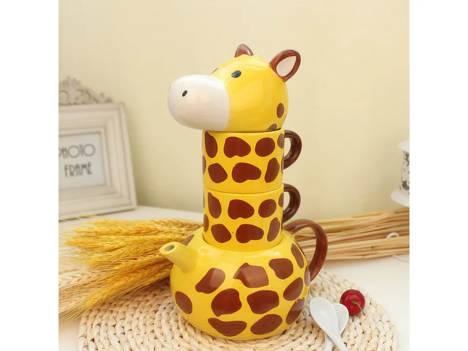 Giraffe ceramic tea set fully stacked together on a woven mat.