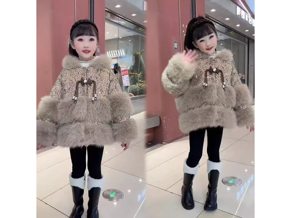 A girl wearing a brown faux fur winter coat with a rabbit design.