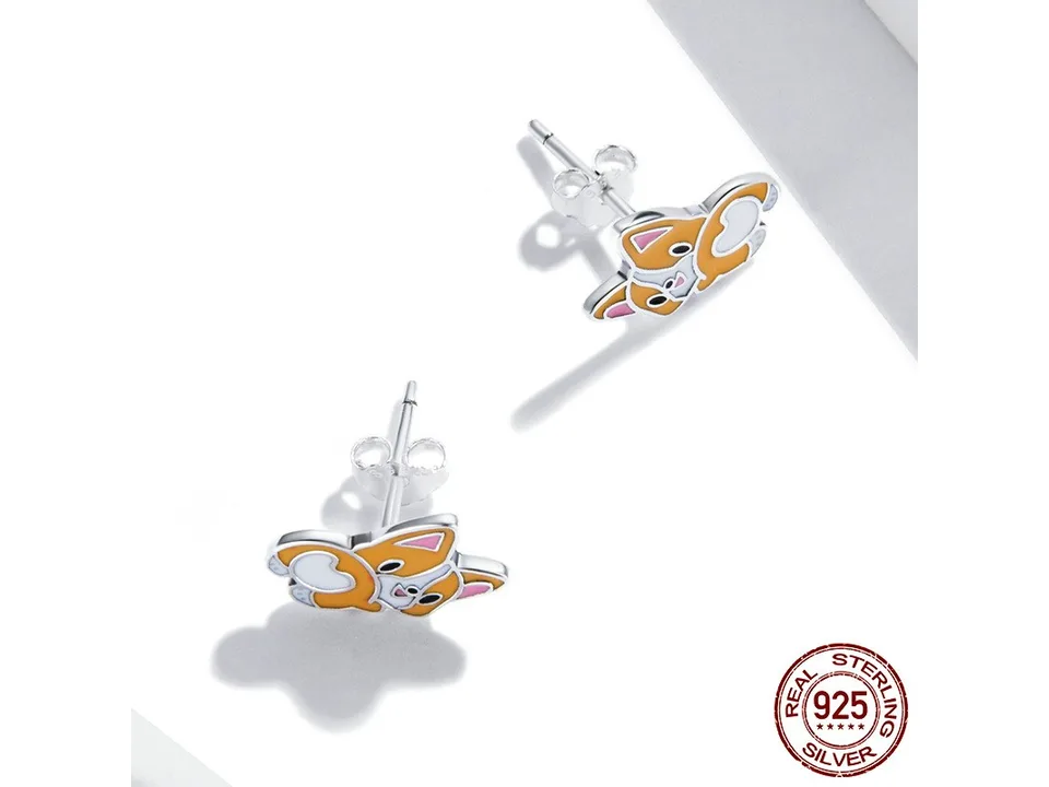 Corgi stud earrings shown from the side to display the post and backing.