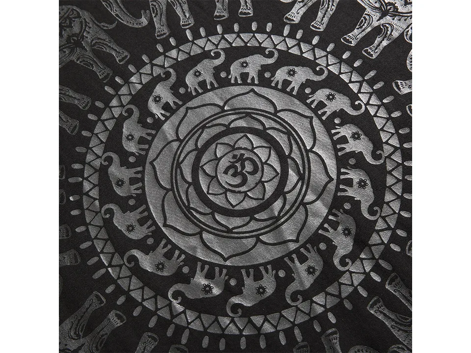 Close-up of the elephant and mandala graphic print on the black t-shirt.