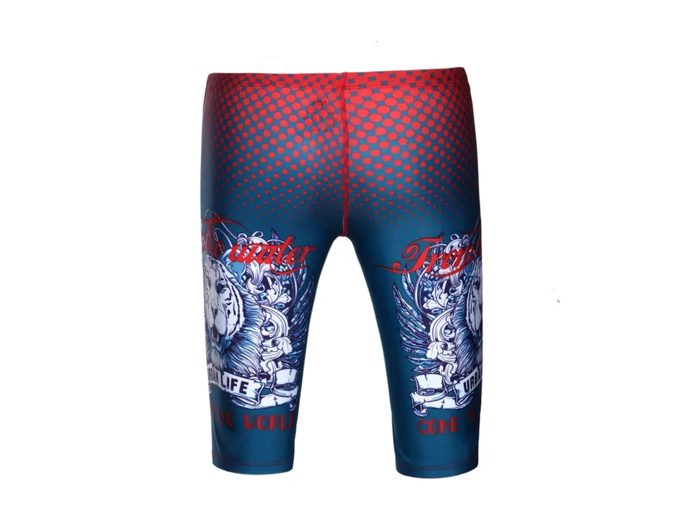 Back view of blue swimming trunks with red polka dots and graphic print.