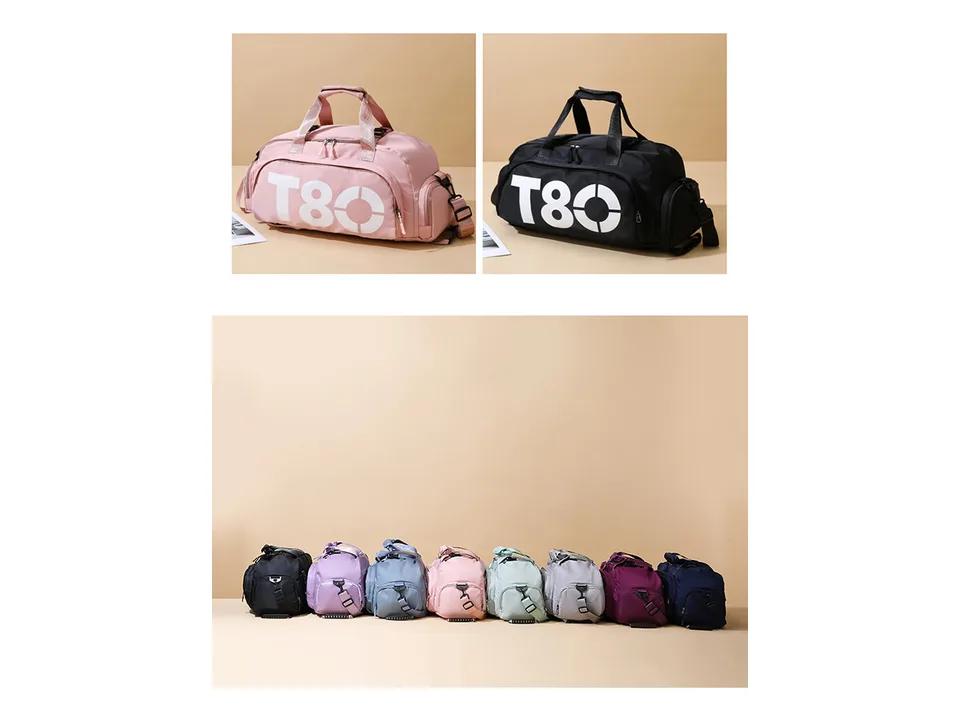 A collection of gym bags in various colors displayed on a surface.