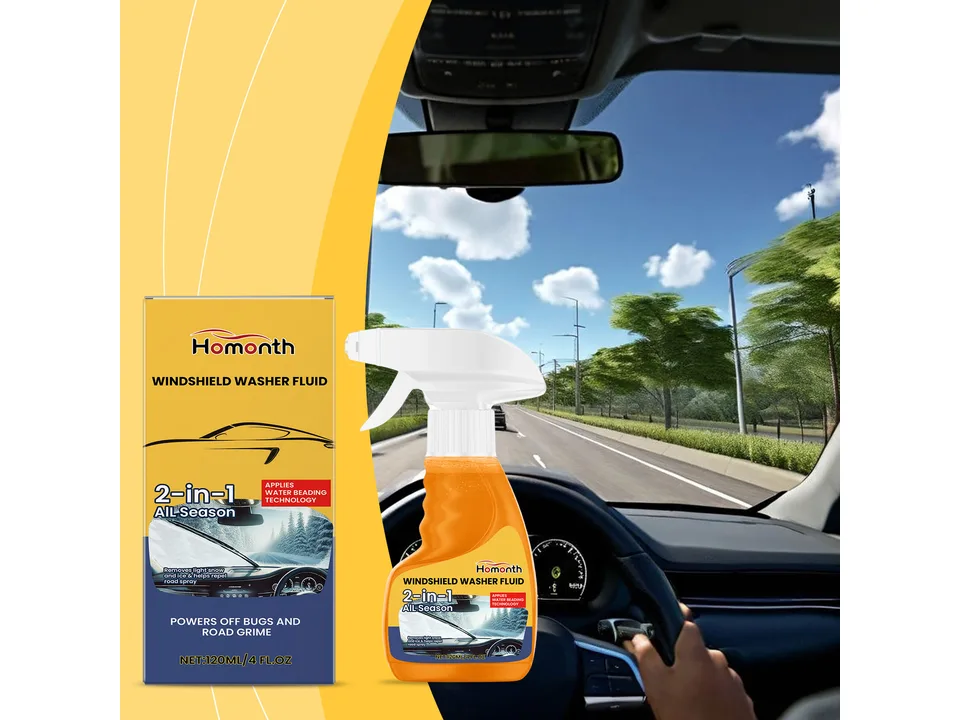 Windshield washer fluid bottle placed in front of a car interior view.