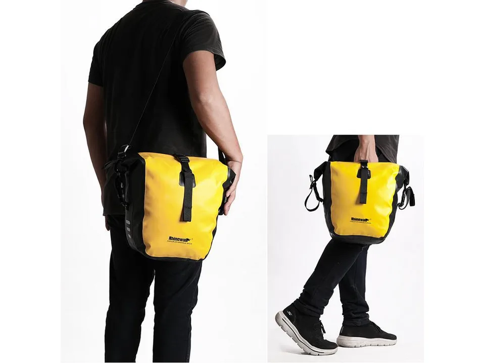 Person carrying the yellow pannier bag as a shoulder bag