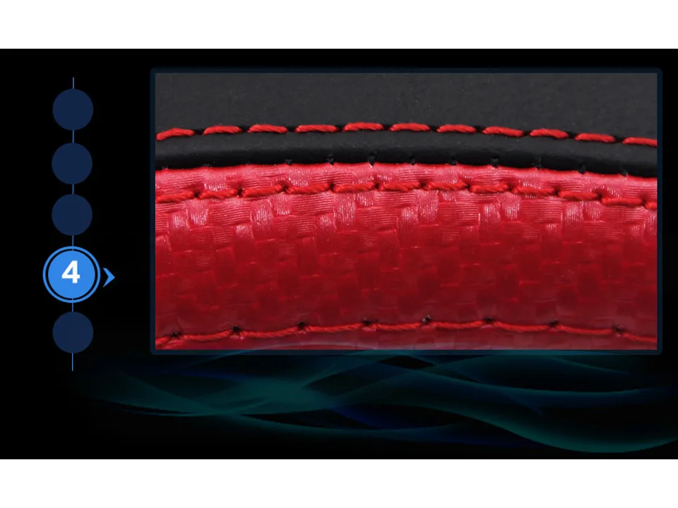 Detailed view of the red stitching on the steering wheel cover material.
