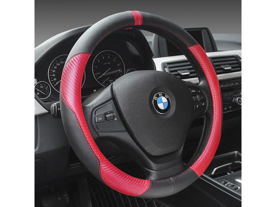 Black and red carbon fiber style steering wheel cover installed on a BMW steering wheel.