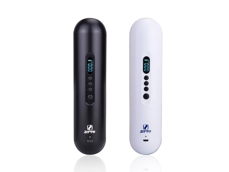 Black and white portable electric air pumps standing side-by-side.