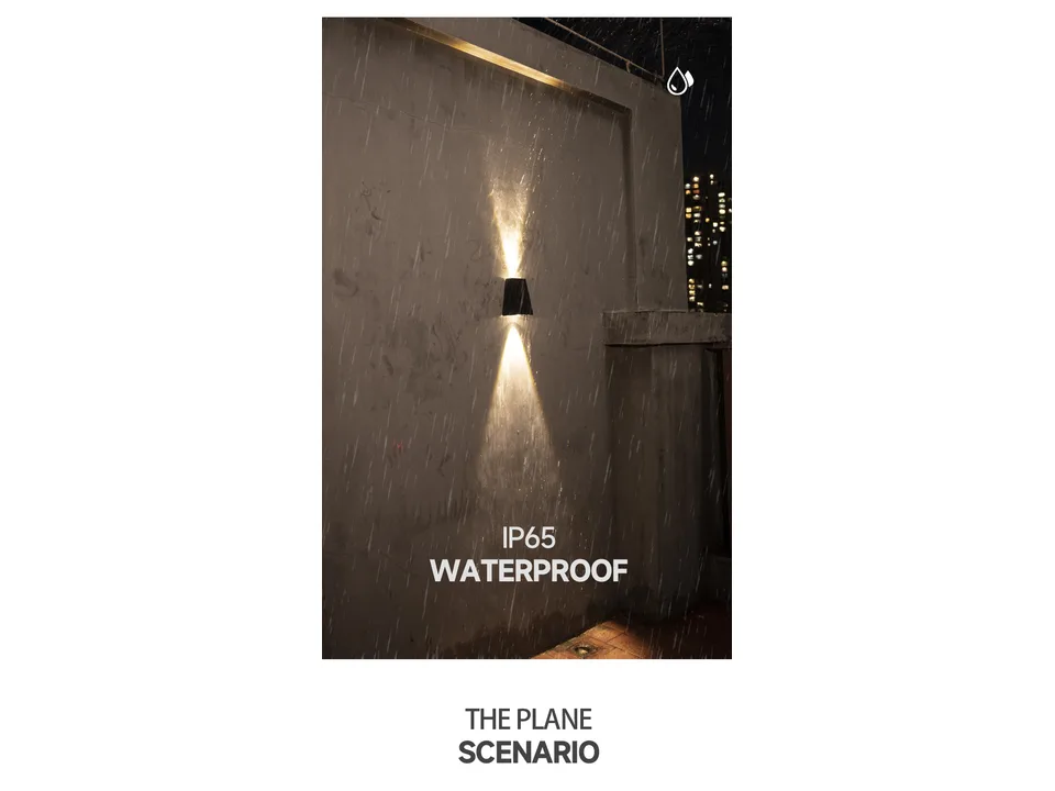 Solar wall lamp mounted on a wall during rain, demonstrating IP65 waterproof rating.