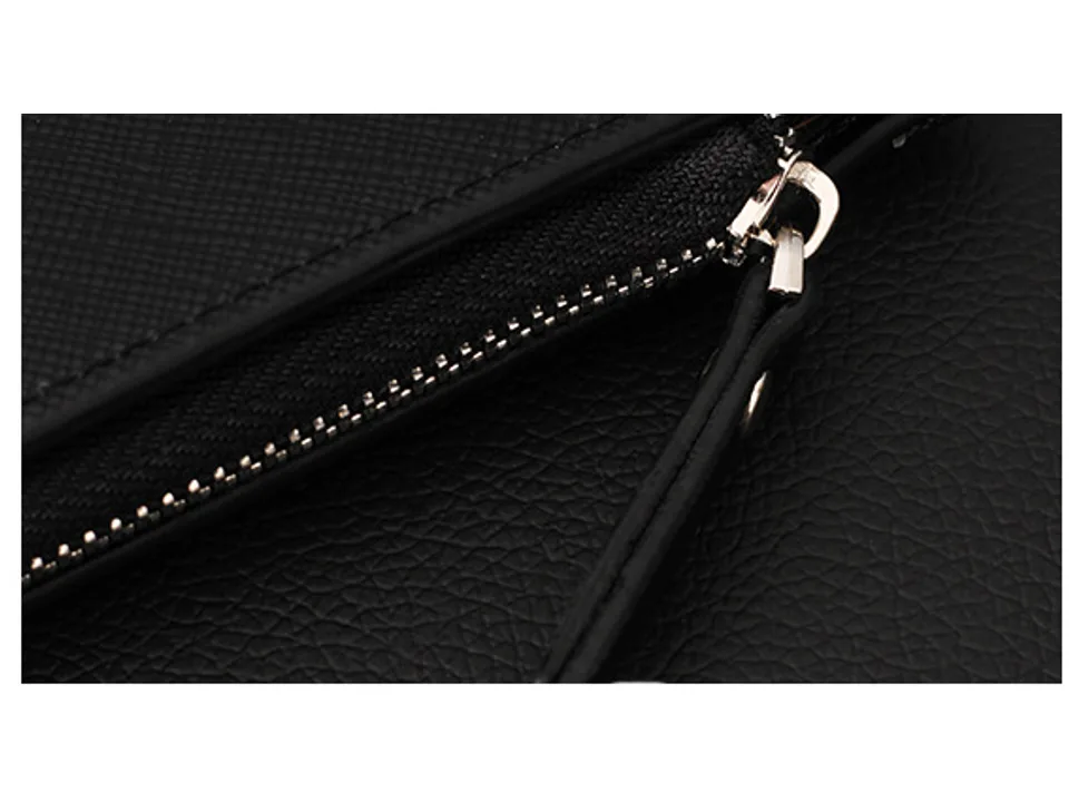 Close-up of the wallet's zipper and textured material.