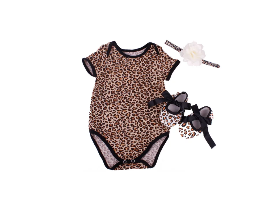Baby romper set with leopard print, matching headband, and shoes.