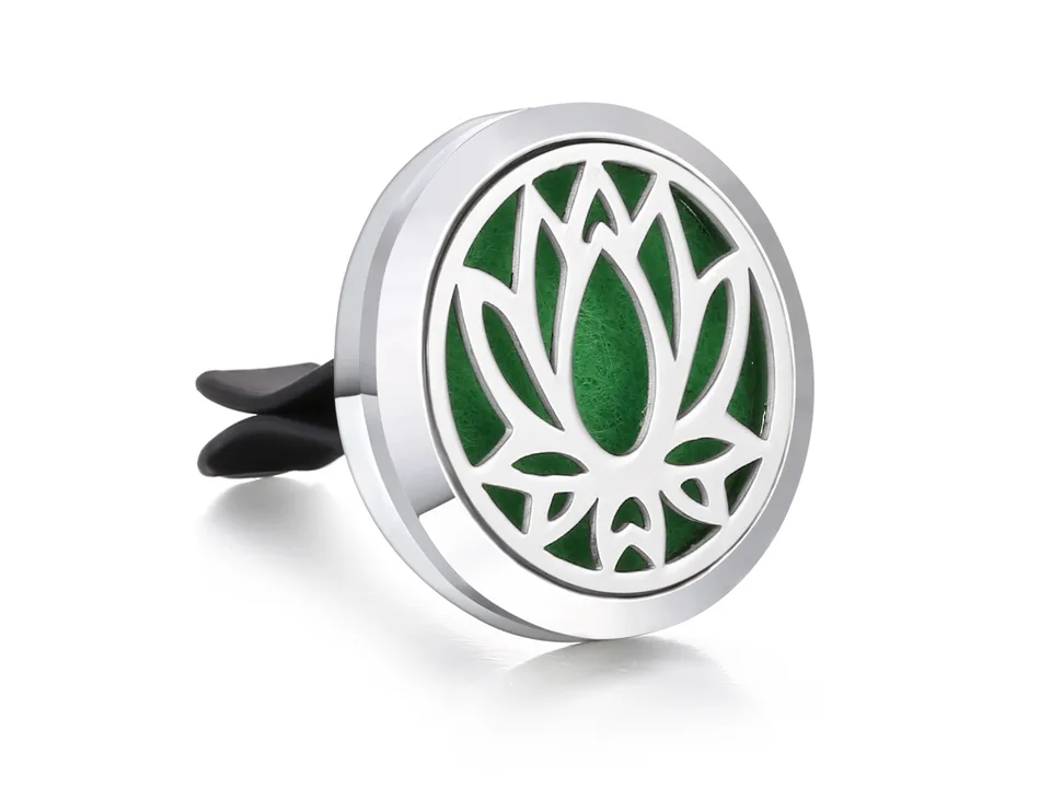 Stainless steel car air freshener vent clip with a lotus flower design and green insert.