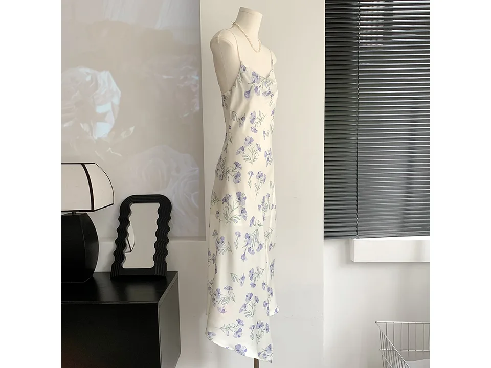 Side view of the floral midi slip dress on a mannequin.