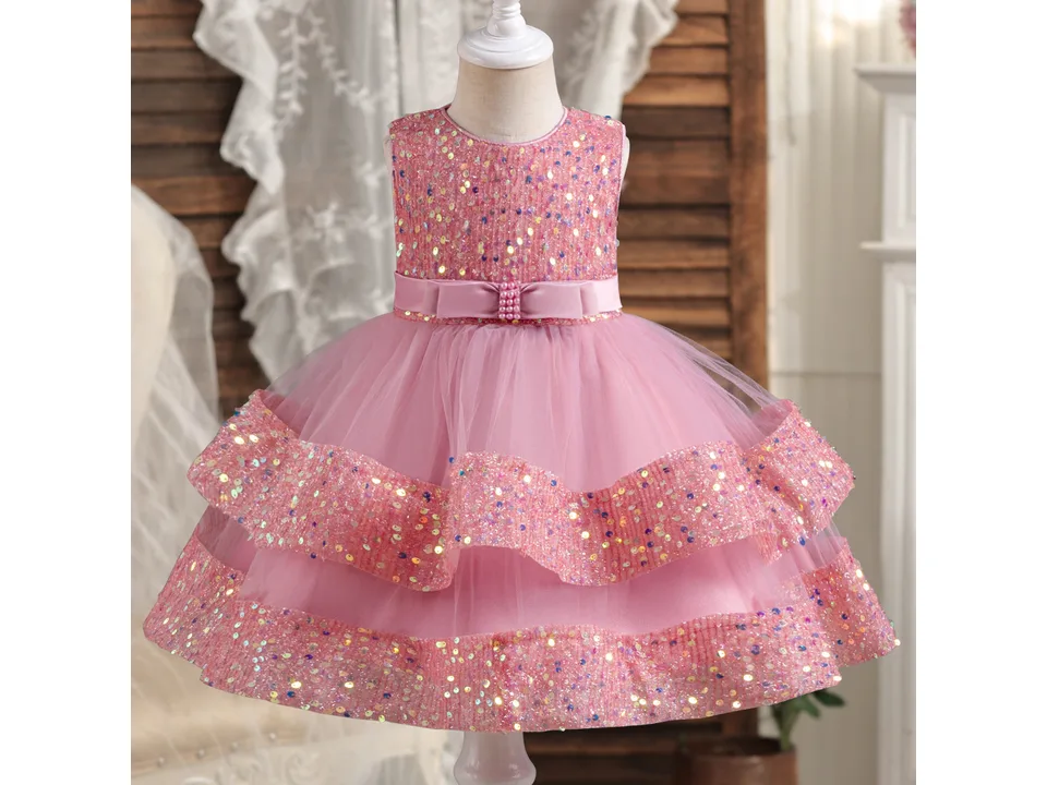 Front view of a pink princess dress with a sequin bodice and tulle skirt on a mannequin.