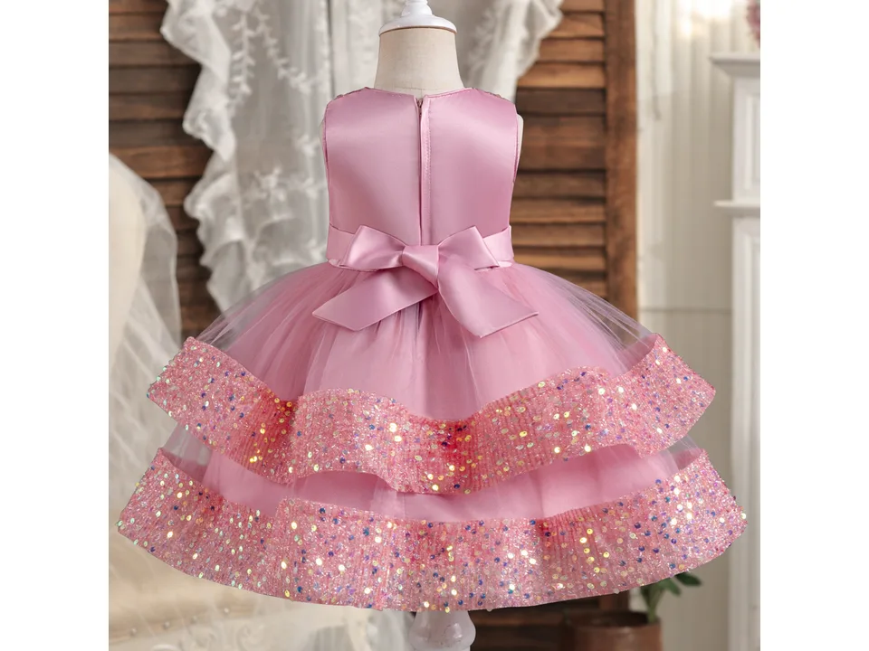 Back view of the pink princess dress showing the bow and zipper closure.