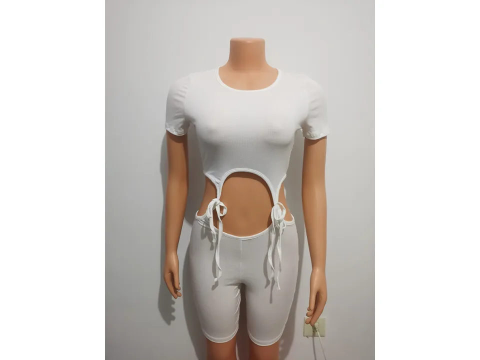 White ribbed knit cutout jumpsuit on a mannequin