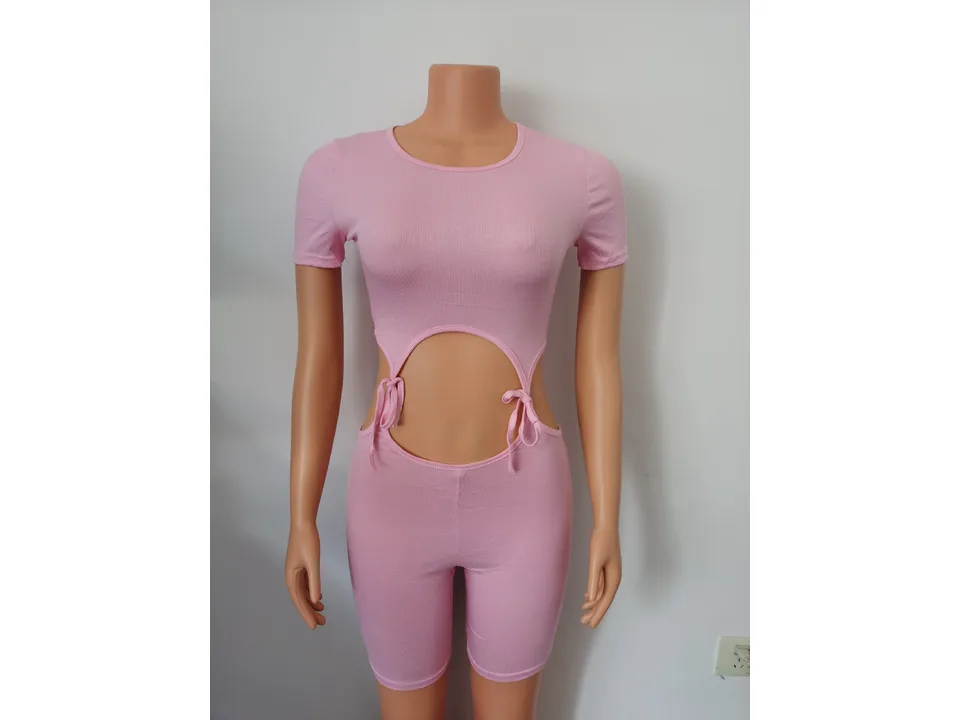 Pink ribbed knit cutout jumpsuit on a mannequin