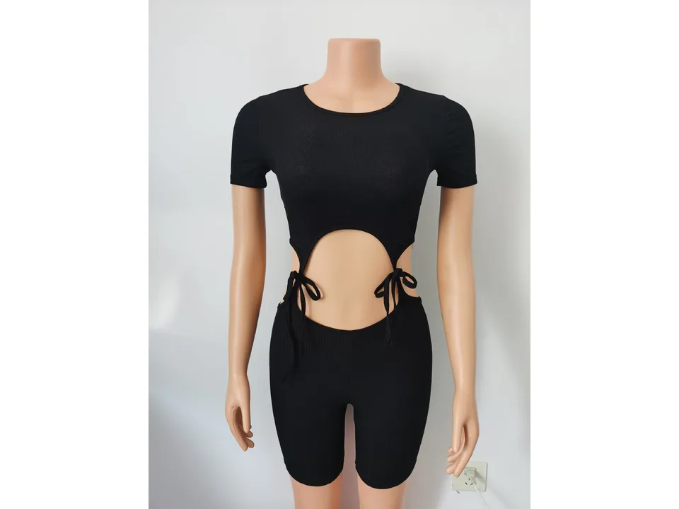 Black ribbed knit cutout jumpsuit on a mannequin