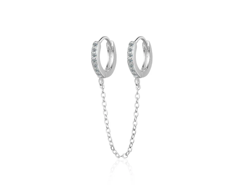 A pair of silver hoop earrings connected by a delicate chain, featuring small embedded crystals.