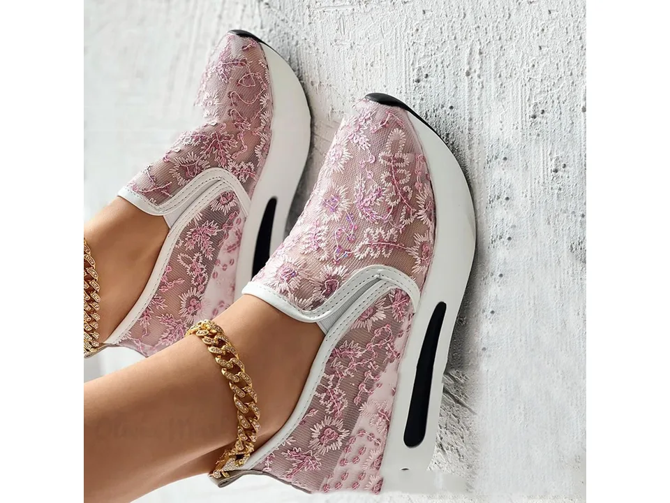 A pair of pink floral mesh slip-on shoes with white platform soles shown from the side.