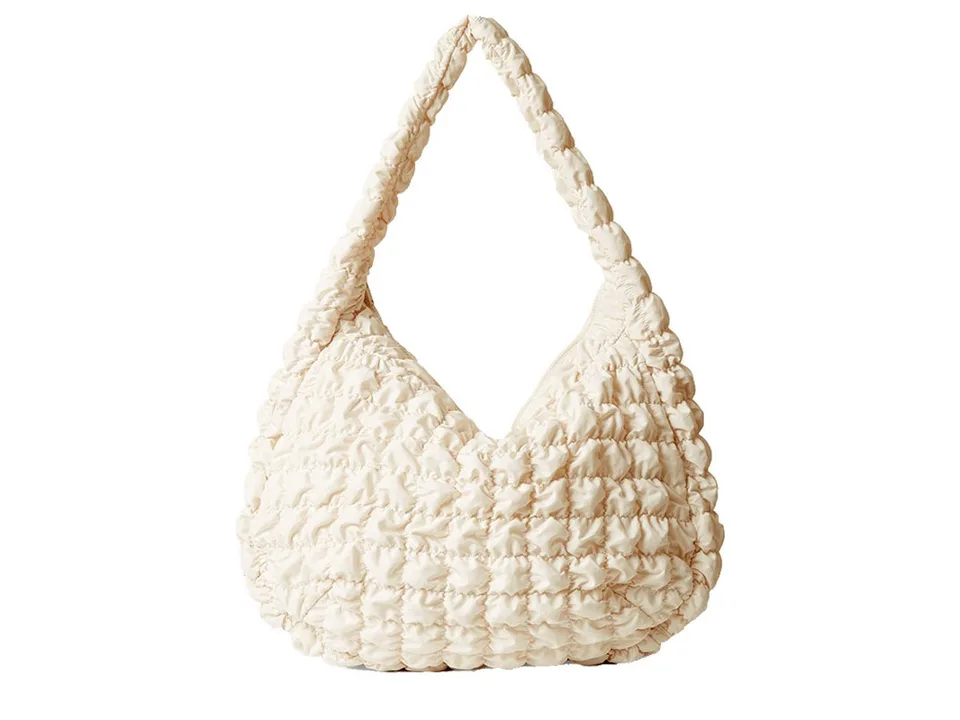 A white quilted nylon hobo-style shoulder bag.