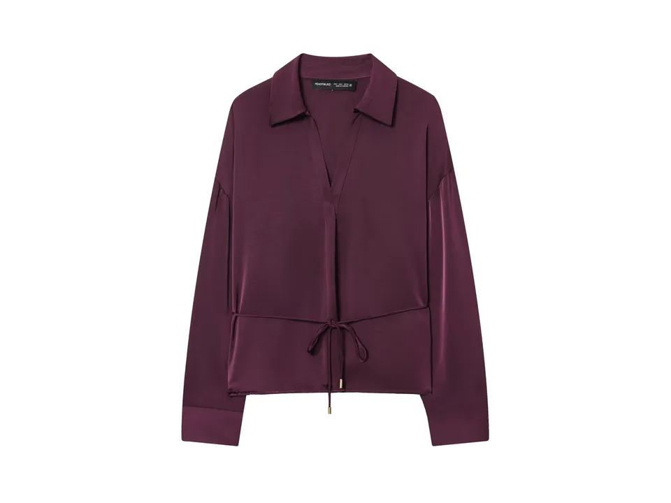 Front view of a burgundy long-sleeve button-down shirt with a waist tie.