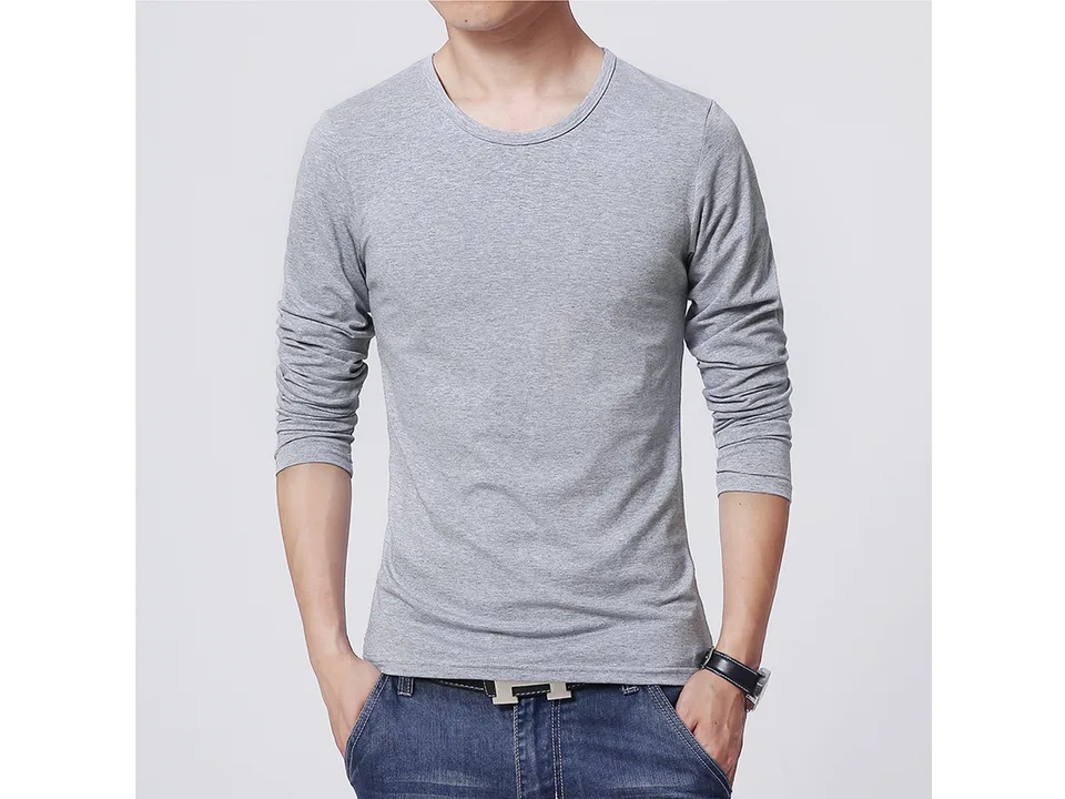 A man wearing a grey long-sleeve crew neck t-shirt.