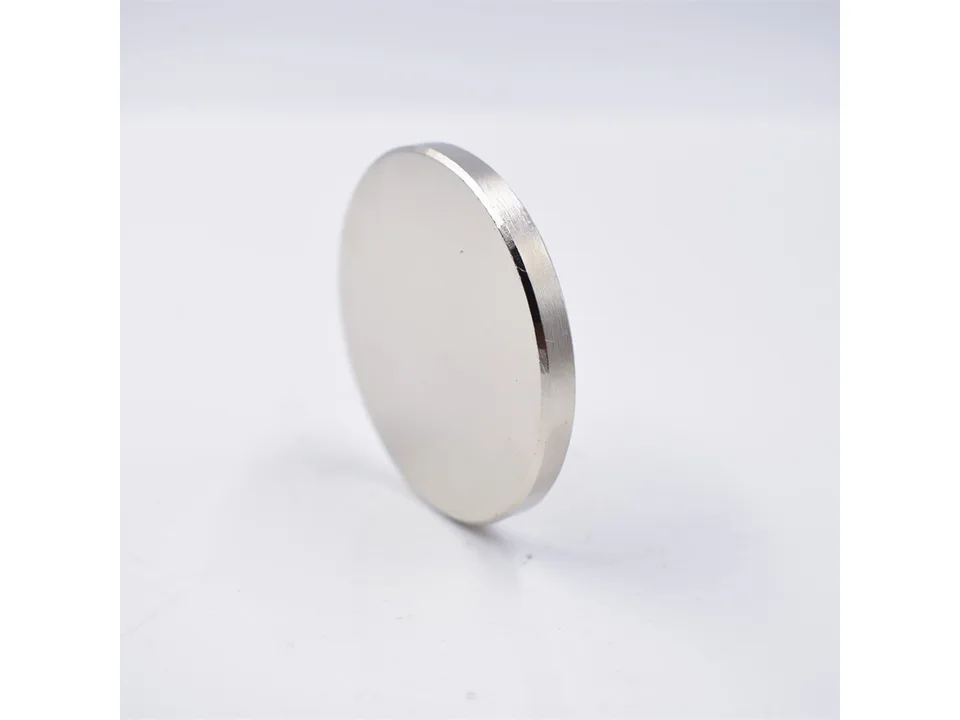 A side-angle view of the circular silver magnetic disk.