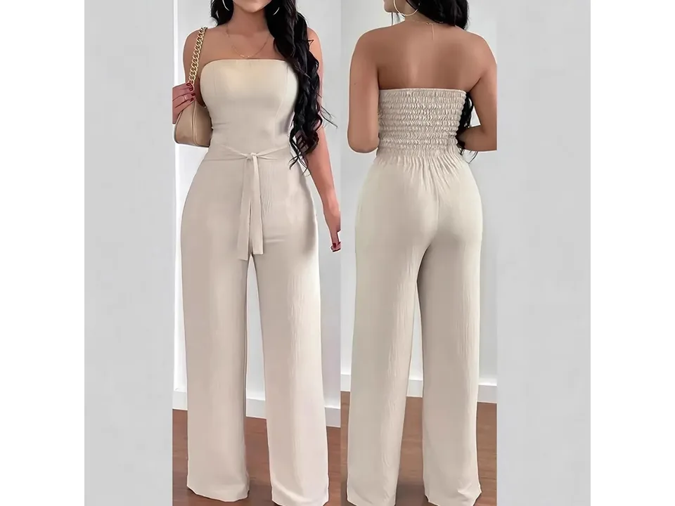 Front and back view of a woman wearing a beige strapless jumpsuit with a belt.