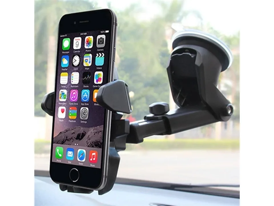 Car phone holder mounted on a windshield with a smartphone attached.